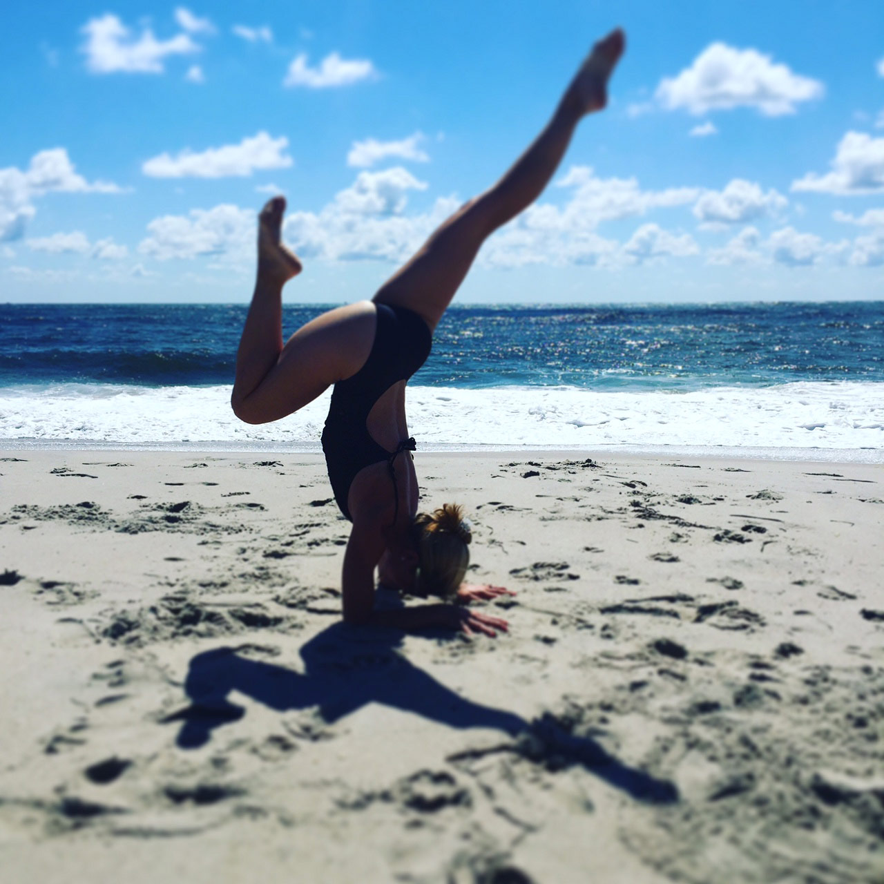 View larger photo of yogi Goldie Oren on the beach