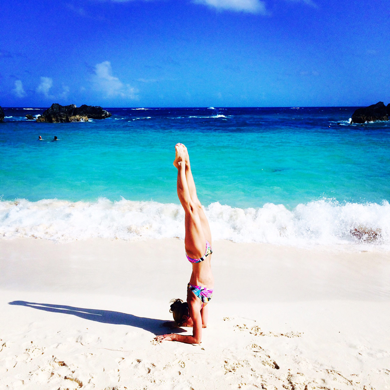 goldie oren doing solo yoga on the beach