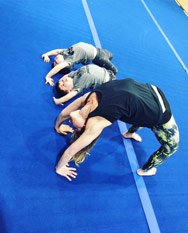 Goldie Oren doing yoga with twin boys